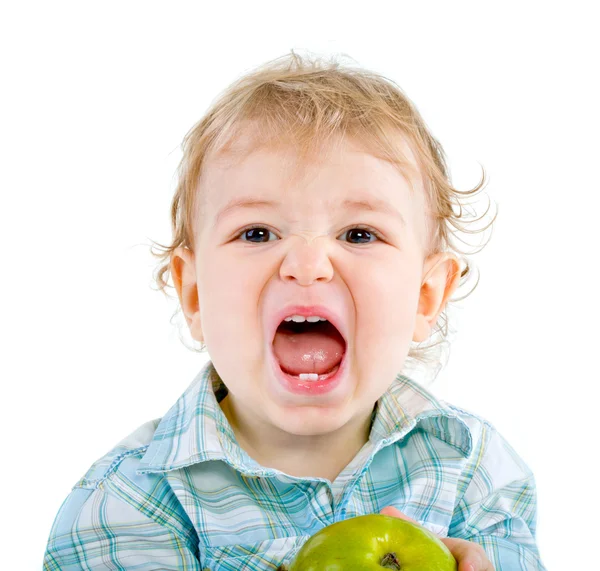 Beautiful baby boy eats green apple. — Stock Photo, Image