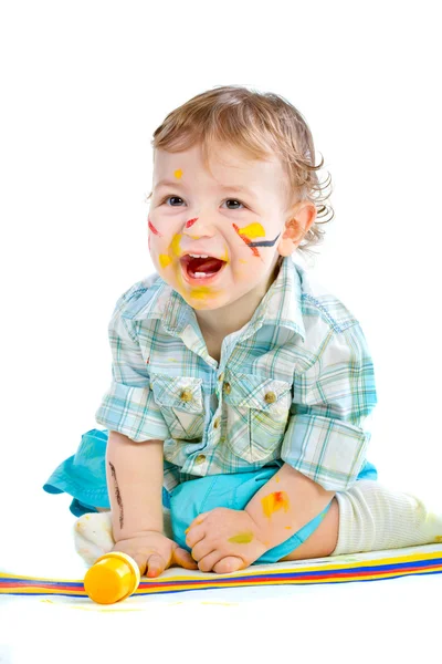 Bellissimo bambino coperto di vernice brillante — Foto Stock