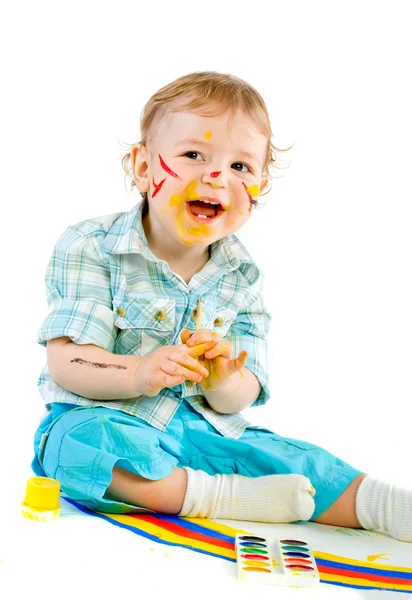 Beautiful baby covered in bright paint — Stock Photo, Image