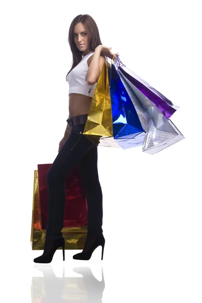Hezká mladá žena s tašky nákupů — Stock fotografie