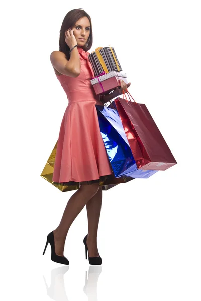 Pretty young womsn with bags of purchases — Stock Photo, Image