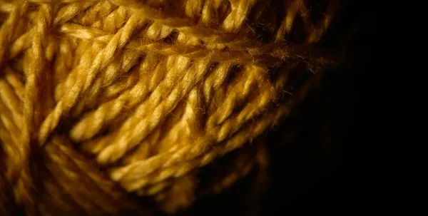 Macro shot of a ball of string texture isolated on black — Stock Photo, Image