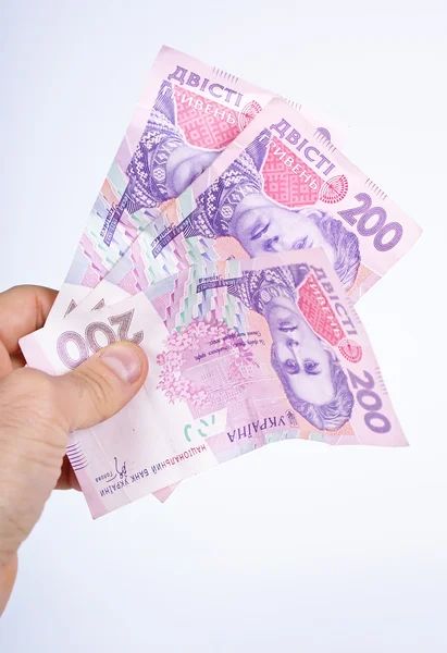 Hryvnia in mans hand — Stock Photo, Image