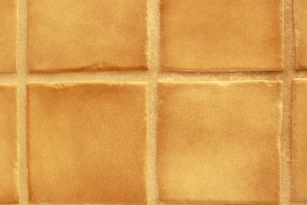 Quadrados de azulejo de parede marrom — Fotografia de Stock