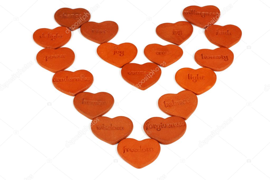 Eighteen inspiring words, one per heart, are baked into small clay symbols of love and arranged altogether as a heart.