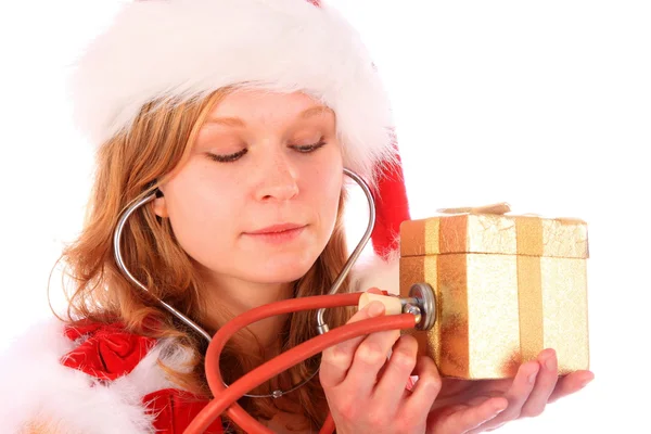 Miss Babbo Natale sta suonando una scatola regalo d'oro — Foto Stock