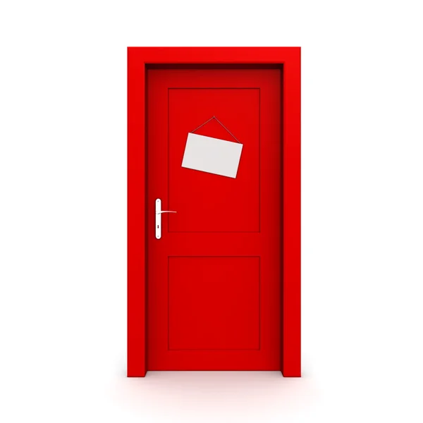 Закрытая красная дверь с табличкой — стоковое фото