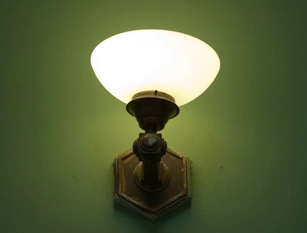 stock image Wall lamp on the green background