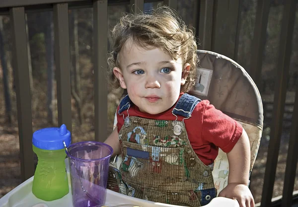 Baby in a Highchair Outdoors — Stock Photo, Image