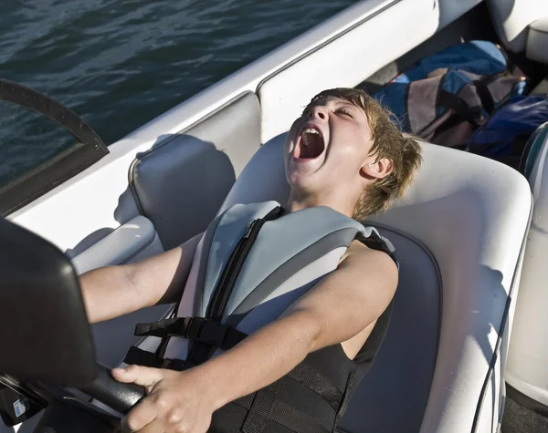 Young Boy Acting Driving Boat Fast — Stock Photo, Image