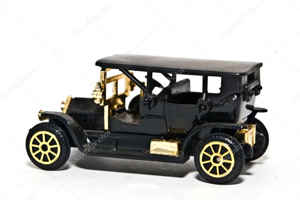Toy replica of a black 4 door car vintage 1920's.
