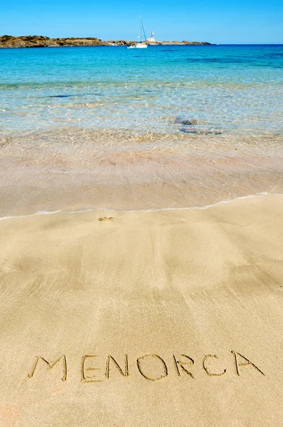 stock image Menorca written in the sand of a beach