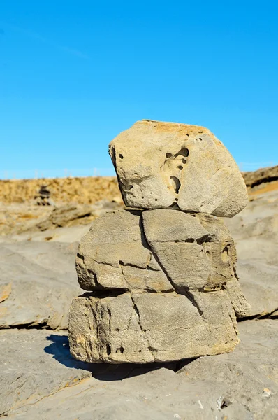 Pile of zen stones on a rocky coast — Stock Photo, Image