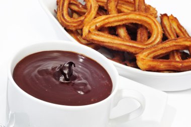 Churros con chocolate, a typical Spanish sweet snack clipart