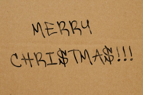Sentencia feliz navidad escrita en un cartón marrón — Foto de Stock