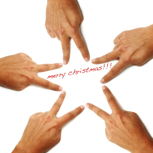 Счастливого Рождества, написанного на белом фоне с руками, рисующими звезду — стоковое фото