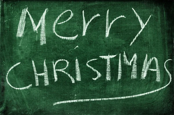 Merry christmas written with chalk on a blackboard — Stock Photo, Image