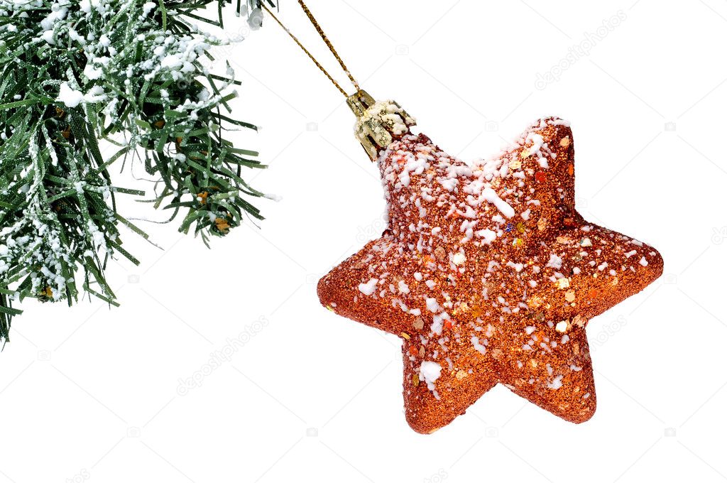 A golden christmas star hanging on a christmas tree on a white background