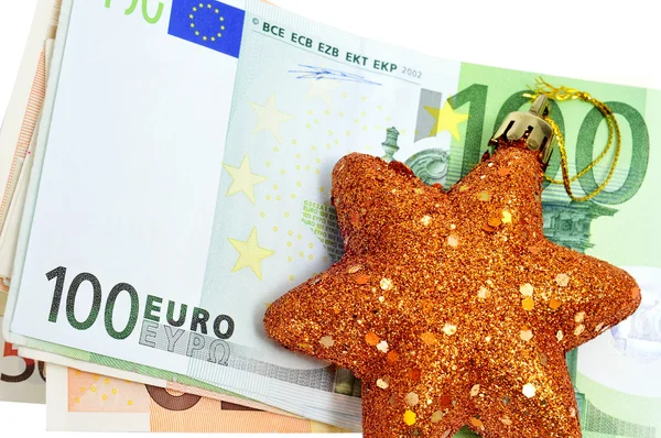 Різдвяна зірка з купюрами євро, що символізують споживання — стокове фото