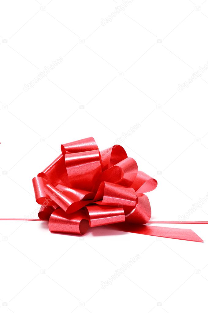 A red gift ribbon bow isolated on a white background