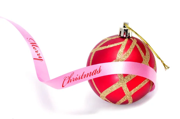 Boldog karácsonyt, írt egy a rózsaszín szalag egy piros-arany karácsony-ba — Stock Fotó