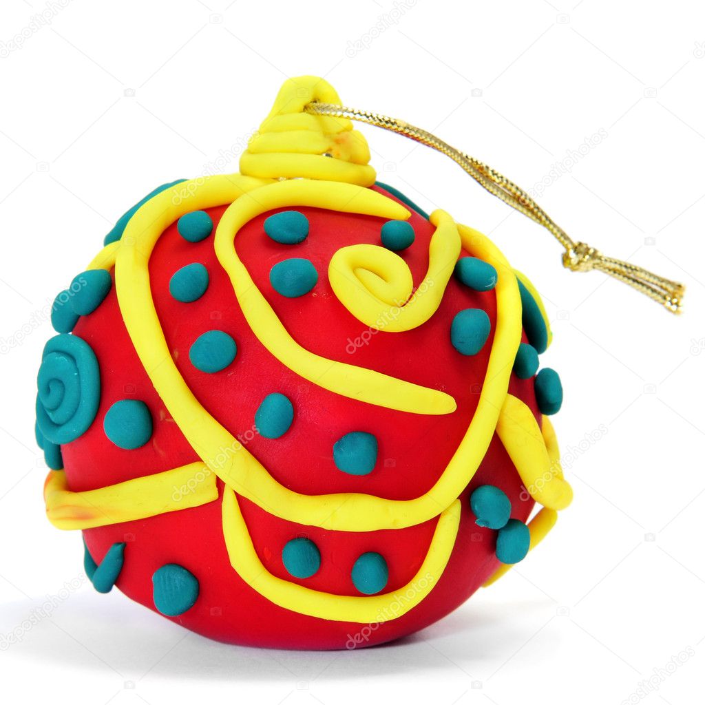 A christmas ball made with modelling clay on a white background