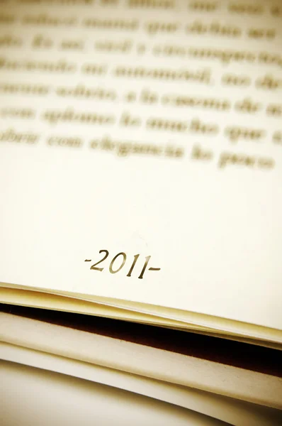 2011 as a footnote on a book page — Stock Photo, Image