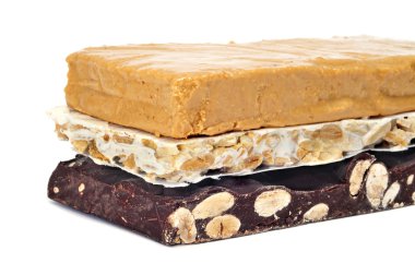 Some pieces of different kind o turron, typical Christmas sweet of Spain clipart