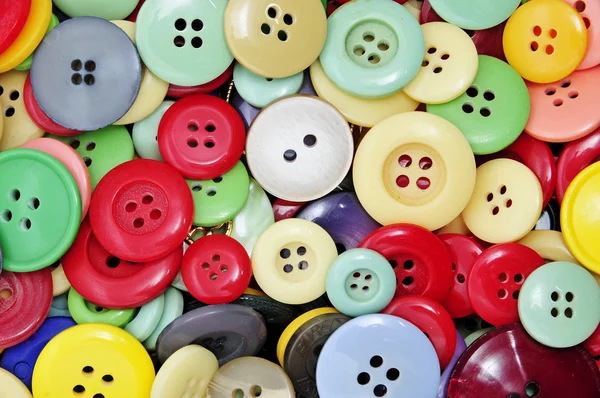 stock image Closeup of a pile of buttons of many colors