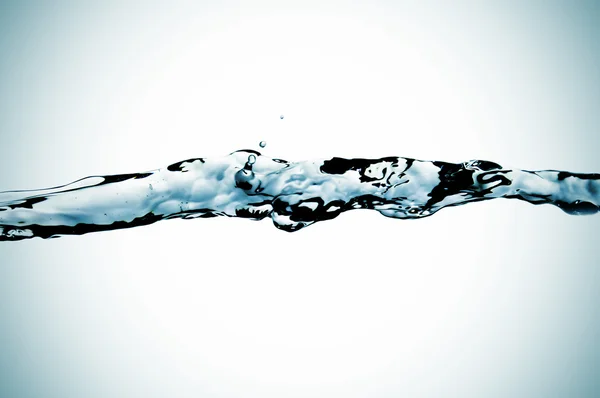 Splash Van Kristallijn Water Een Aangetaste Achtergrond — Stockfoto