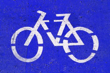 Bicycle-only lane sign painted on the street clipart