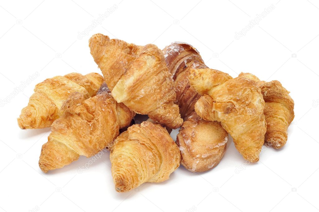 A pile of croissants isolated on a white background
