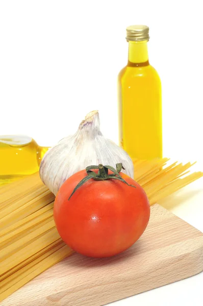 stock image Some ingredients of italian cuisine, like pasta, olive oil or tomato