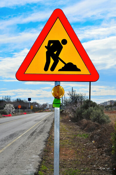 A road works sign in a road under construction