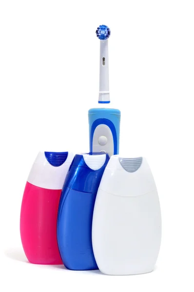 Cepillo de dientes eléctrico y pasta de dientes — Foto de Stock