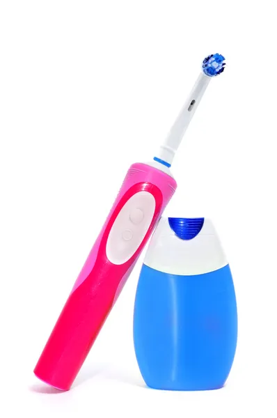 Електрична зубна щітка та зубна паста — стокове фото