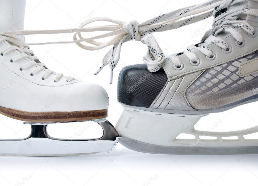 Skate for figure skating and hockey skate tied against each other close up isolated on white background