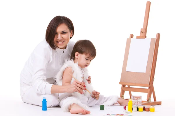 Happy mom and painting near easel — Stock Photo, Image
