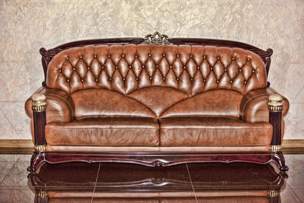 stock image Antique leather brown sofa in the room