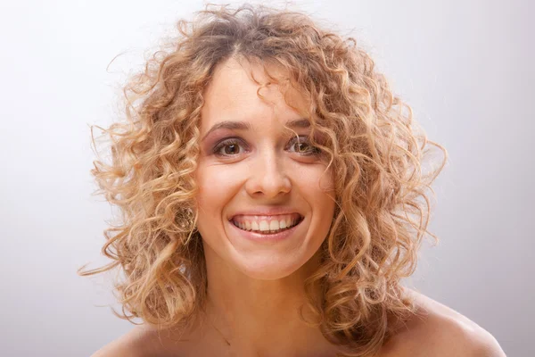Smiling women with curly hair — Stock Photo, Image