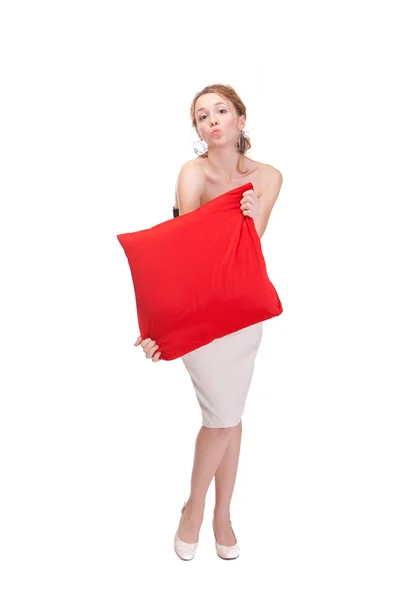 Beautiful woman showing red empty pillow — Stock Photo, Image