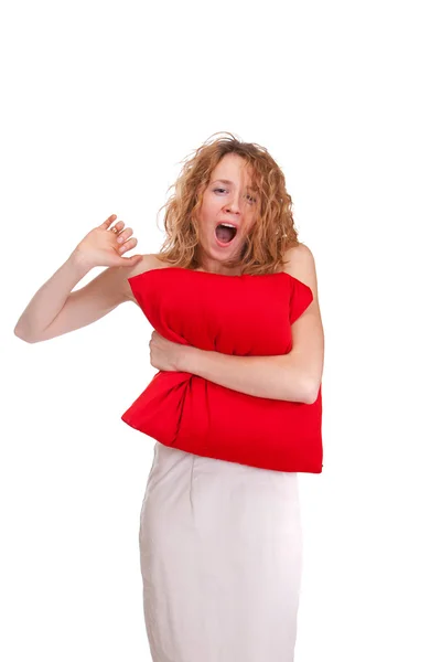 Young beautiful sleepy yelling woman with large red pillow — Stock Photo, Image