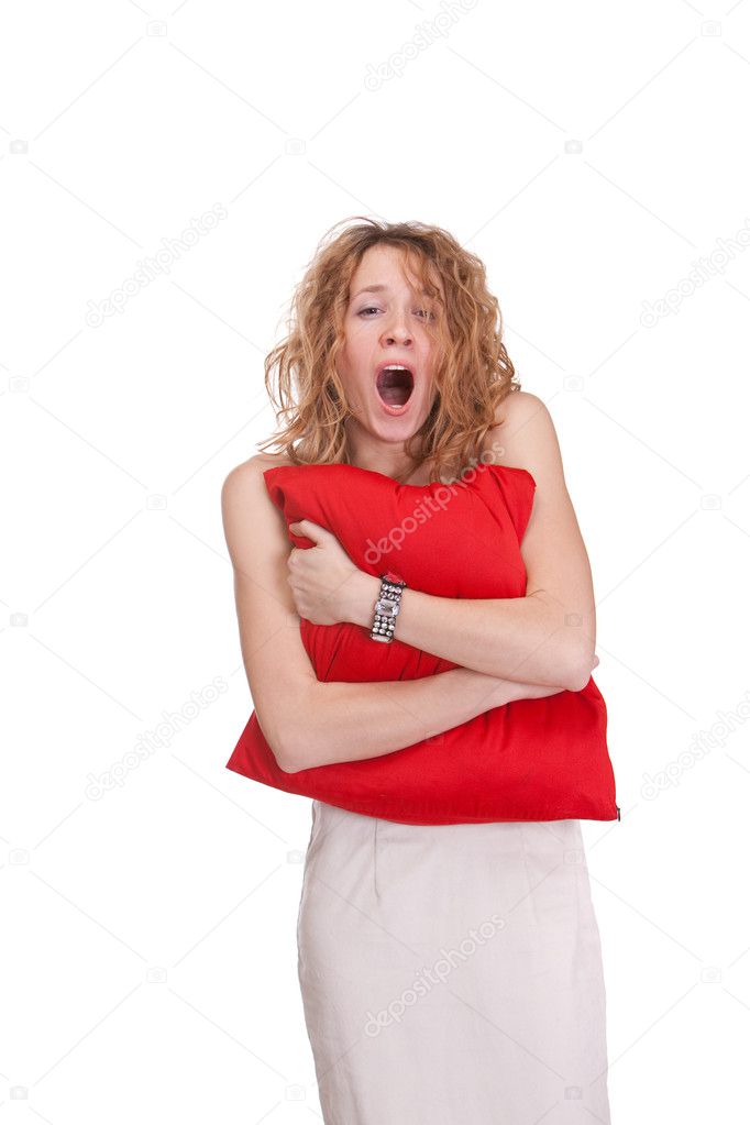 Young beautiful sleepy yelling woman standing with large red pil
