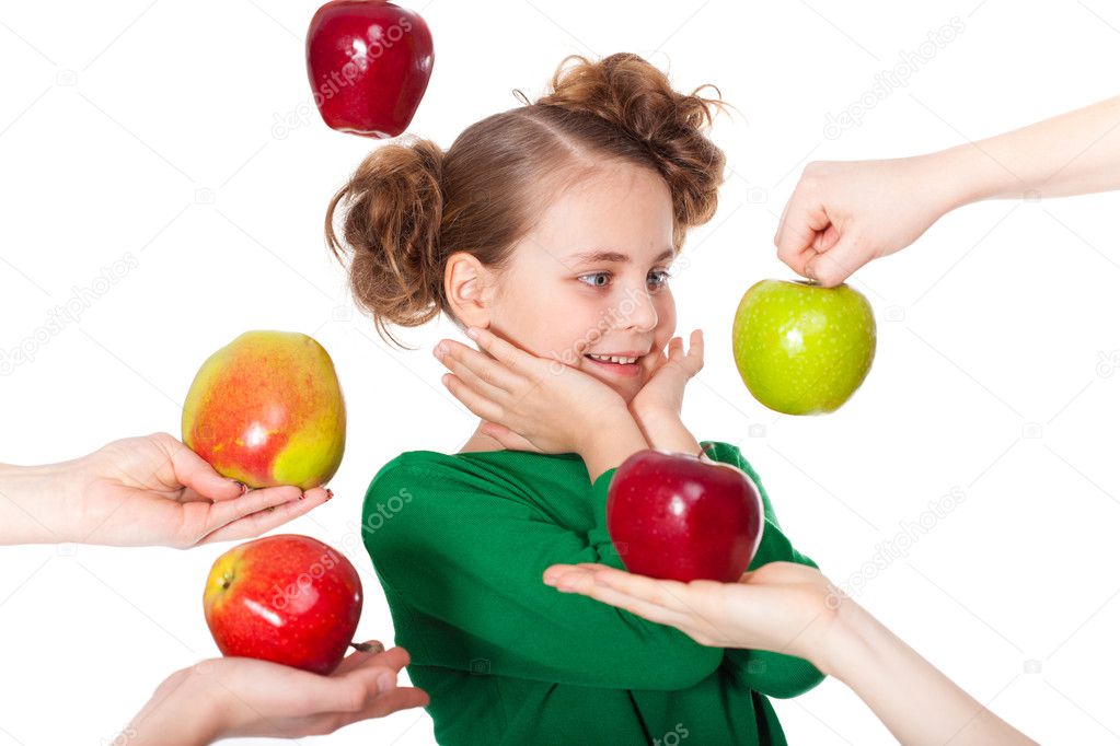 Surprised smiling girl choosing among proposed apples