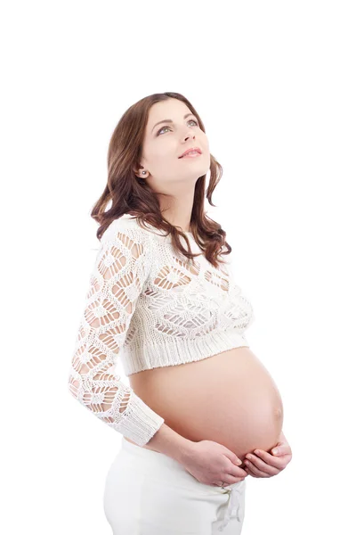 Mujer embarazada soñando sosteniendo su vientre mirando hacia arriba —  Fotos de Stock