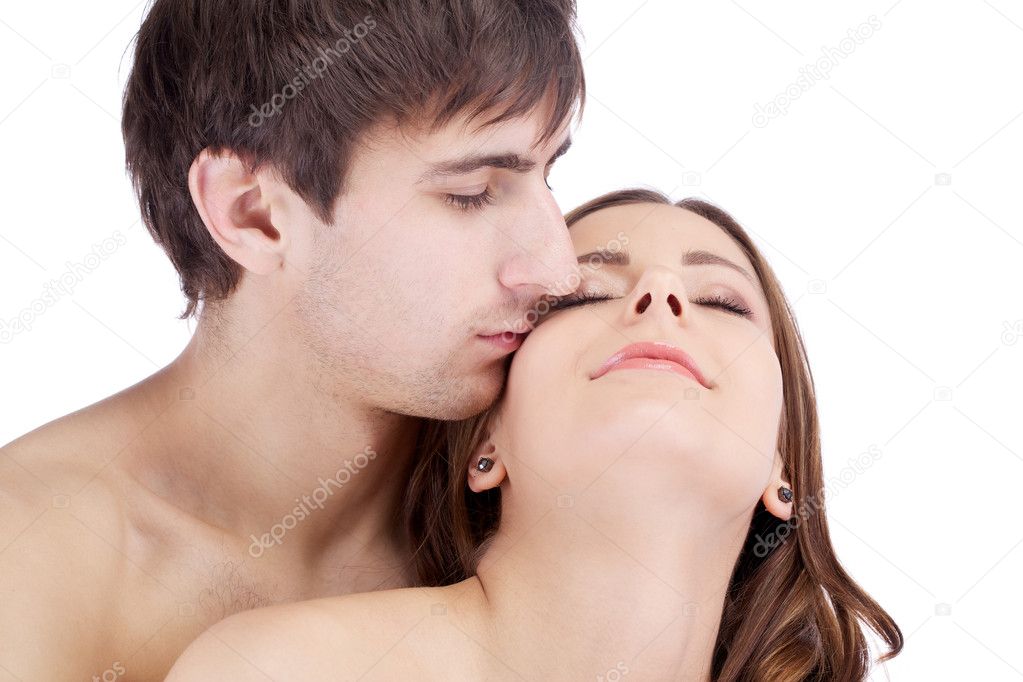 Sensual kissing dreaming couple of young lovers