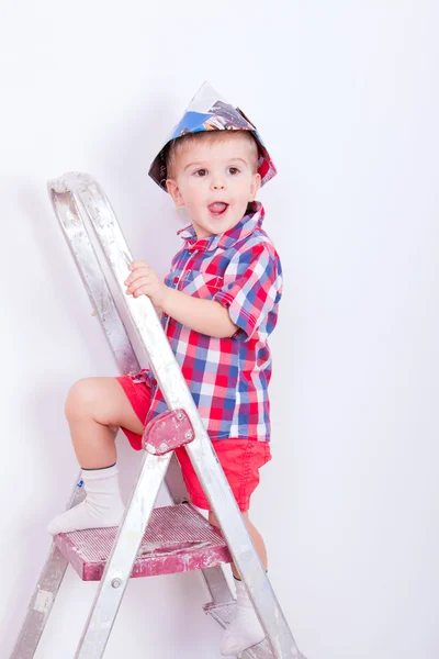 Little painter with open mouth on ladder — Stock Photo, Image