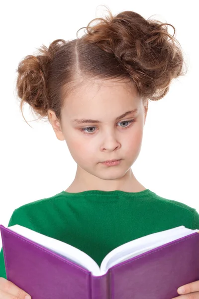 Surprised girl looking at book — Stock Photo, Image