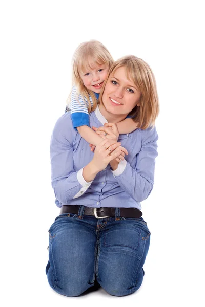 Smiling embracing mom and daughter — Stock Photo, Image