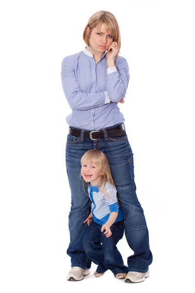 Playful child disturb mother to talk on cell — Stock Photo, Image